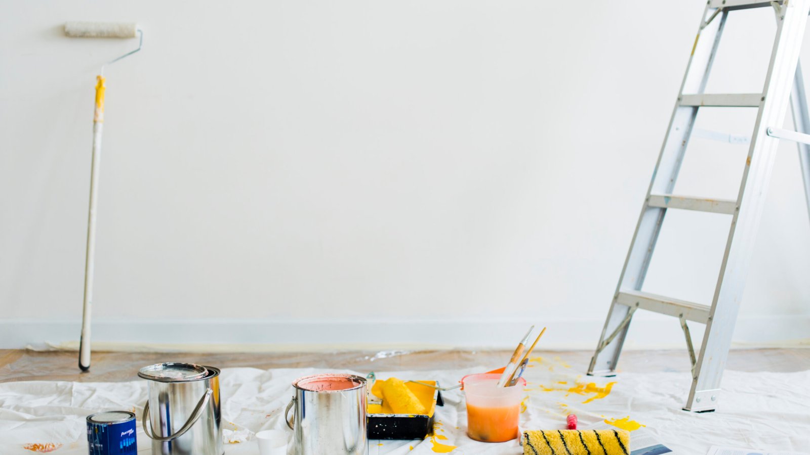 Buckets of paint on the floor